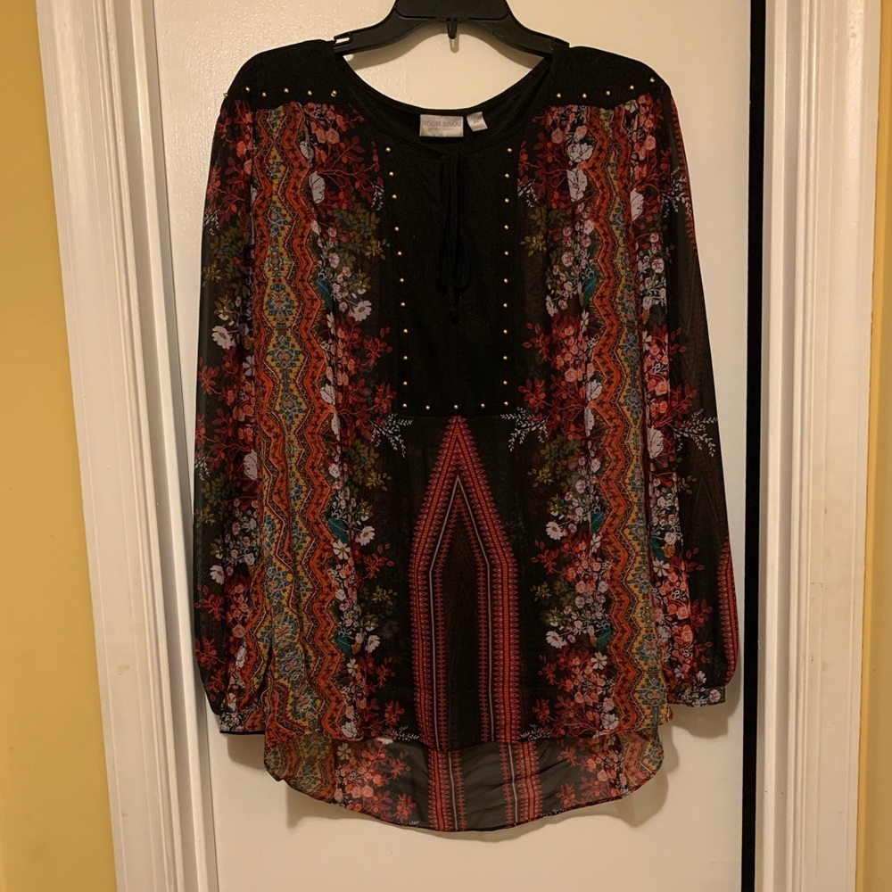 Red blouse with floral print.